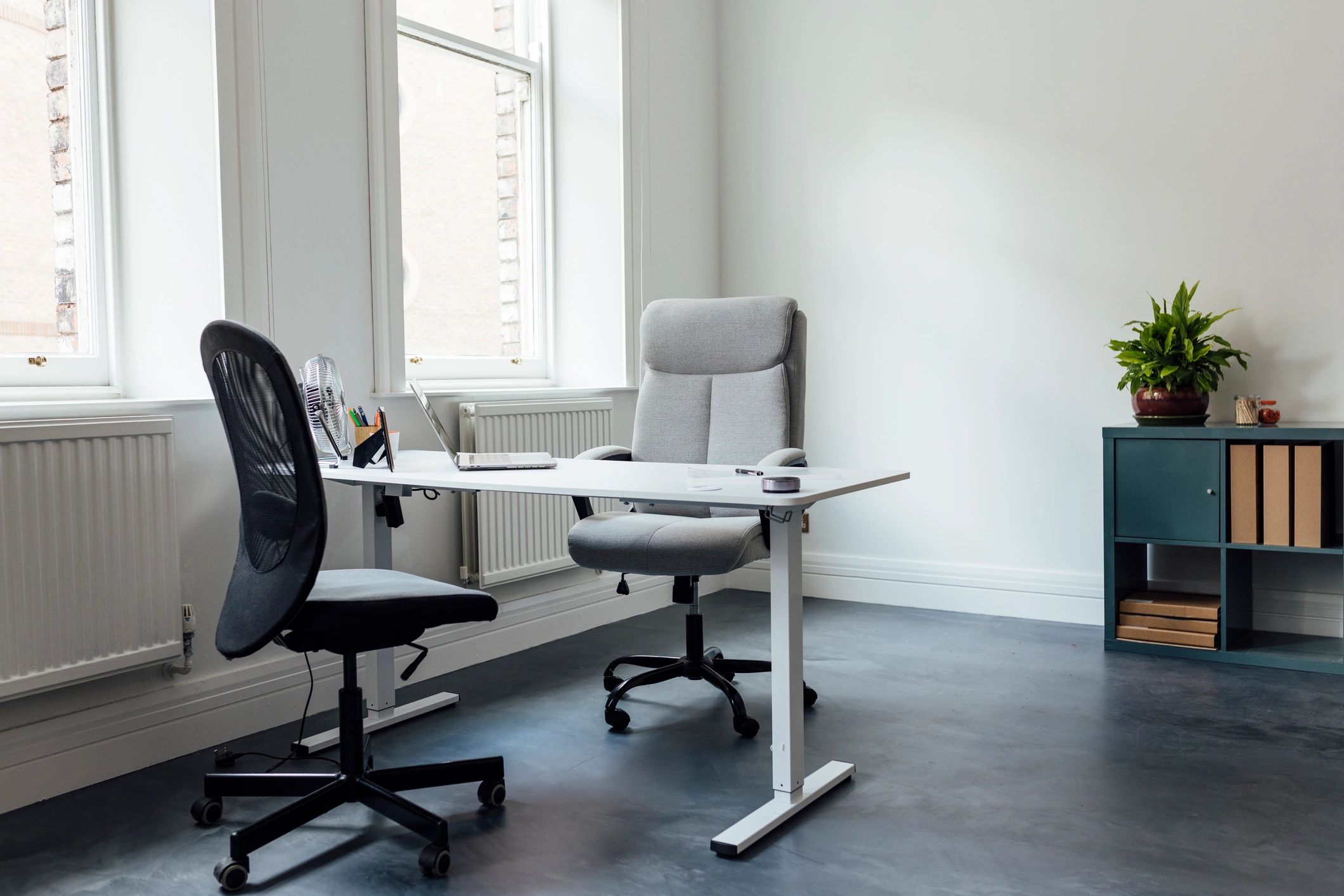 Magazine-style workspace with desk and office equipment